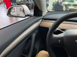 Vilner created a unique interior for the tesla model 3 by using fabrics, wood trim, and bright colors to liven up the ev's greenhouse. Tesla Inventory In Germany Hints Fremont Made Model 3 Now Includes New Door Trim Drive Tesla Canada