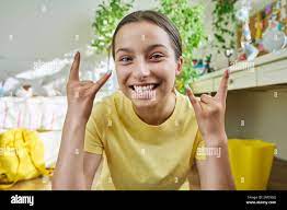 Teenage female student having video call, looking at webcam Stock Photo -  Alamy