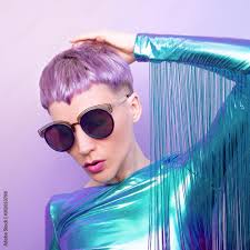 Futuristic Fashion Lady with violet short hair. Trendy haircut Stock Photo 