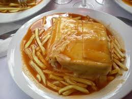 The sandwich is then topped with more cheese, usually taken to the oven to melt, and lastly, a slightly spicy sauce is added on top. Francesinhas