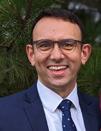 family history consultant, and pianist.