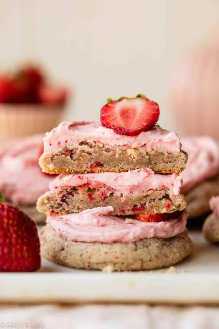 Strawberry Biscuit Cookies stacked with icing drizzle