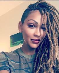 Goddess Black And Blonde Faux Locs Meagan Good Gets Blonde Faux Locs For Fall Shaved Side Hairstyles Faux Locs Hairstyles Braids With Shaved Sides