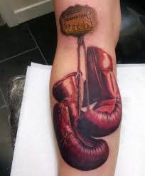 Boxers often do this kind of tattoos to intimidate his opponent. Memorial Style Colored Boxer Gloves With Lettering Tattoo On Arm Tattooimages Biz