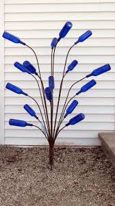 Bottle Tree Creations For Your Garden From Wisconsin Glass Garden Art Wine Bottle Trees Garden Art