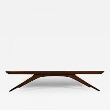 Table has a unique style with intertwined legs and table top with unique edge. Vladimir Kagan Vladimir Kagan Coffee Table