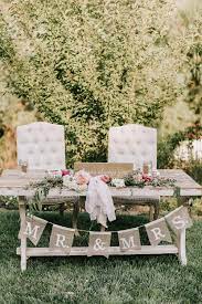 Pretty In Pink A Backyard Wedding With Relaxed Elegance Ruffled Wedding Backyard Reception Backyard Wedding Decorations Wedding Reception On A Budget
