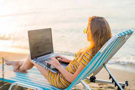 coder relaxing by the beach