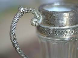 Does it have a bunch of stamped areas on it that look approximately like the pics below? Antique Silver Plate Price And Value Guide