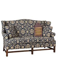 A wonderful living room arrangement in a colonial style. Irvin S Tinware Wingback Sofa