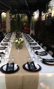 Dining table set with elegant place settings. Dinner Party Setup For 24 People Party Setup Dinner Party Table Settings