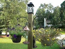 Diy Bird Feeder Pole System Build This Freestanding Bird Feeder And Flower Post Garden Yard Ideas Bird Feeder Stands Bird Houses