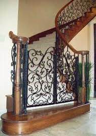 Iron Dog Gate Evans Weaver Love This We Use Iron Baby Gates To Control Where The Dogs Are But Love The Look Of Thi Dog Gate Iron Decor Pet Gates For