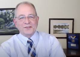 Dr. Mark Denison speaks