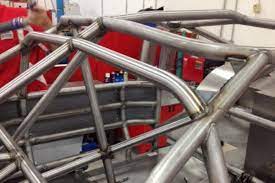 Well documented in previous moto iq articles (here and here), we started the roll cage process by stripping what was left of the interior and then using dry ice to remove the sound deadening. Mcg Exclusive 2013 Nascar Roll Cage Mac S Motor City Garage