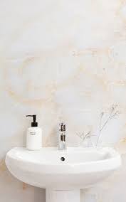 In this bathroom, found on domino, gold definitely dominates. White Gold Marble Wallpaper Mural Hovia Uk Gold Marble Wallpaper Marble Wallpaper White Wallpaper