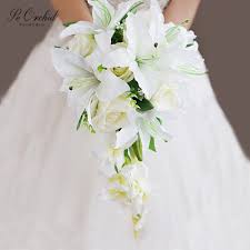 Stargazers, roses & cymbidium orchids cascade: Lily Arrangements And Bouquet Ideas