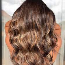 To style, create loose waves using a curling iron and then run your fingers through the curls for a carefree, effortless look. Creating Dimensional Blonde Hair With Lowlights Wella Professionals