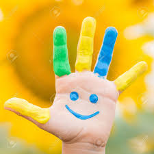 Happy Kid With Smiley On Hand Against Spring Yellow Sunflower ...