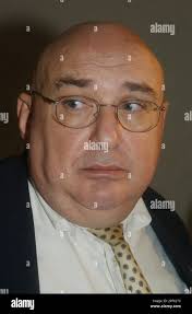 Attorney Fred Radolovich, representing Allen Dwayne Coates, 37, of  Irvington, Ky., speaks following Coates' arraignment before Jefferson  County District Judge William Ryan Thursday, July 17, 2003, in Louisville,  Ky. Ryan ordered a