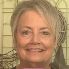 What hairstyle and makeup would suit a 66-year-old woman?