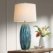 Also having a stunning gold brass rod and base. Possini Euro Eneya Blue Ceramic Table Lamp 7d694 Lamps Plus