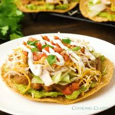 Where can i find tostada shells? Super Delicious Tostadas Layered With Crisp Tostada Shell Guacamole Refried Beans Lettuce Chicken Cheese And Pic Mexican Food Recipes Tostada Recipes Food