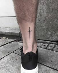 What do sword tattoos symbolize? Small Sword Tattoo On The Left Calf By Nerdy Match Marco Small Tattoos For Guys Sword Tattoo Leg Tattoos Small
