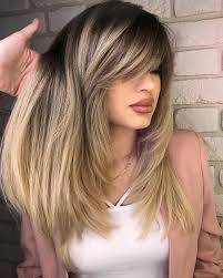 These medium length side bangs create the shape and texture of a shorter fringe by sweeping down and then out to blend in with some face framing layers. 50 Cute Long Layered Haircuts With Bangs 2021