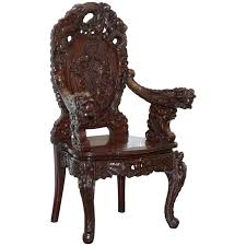 Adorned with sculpted human skulls. Vintage Circa 1940s Japanese Export Dragon Throne Armchair Heavy Rosewood For Sale At 1stdibs