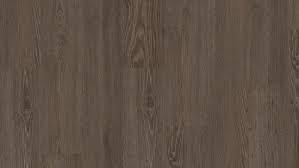 An embossed in register surface provides beautiful realistic wood textures by creating indentations to mimic real wood grains that exactly match the image layer of the laminate plank. Bench Oak Dark Woodstock 832 Laminate