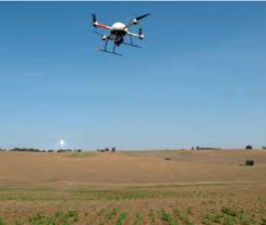 The quadrocopter UAV, model md4-1000, flying over the experimental...