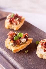 Unlike most bruschetta recipes that use baguette, four peaks use their own house made focaccia bread for the bruschetta. Spicy Sausage Sun Dried Tomato And Goat Cheese Crostini I Just Make Sandwiches