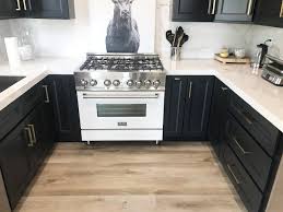This barstool features a distressed black finish. Enhance Your Interiors With A Cutting Edge Black And White Kitchen
