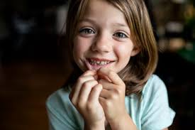 Check spelling or type a new query. Portrait Of Happy Girl Showing Tooth Gap At Home Stockphoto