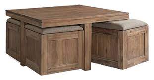 Tucked under this solid acacia wood cocktail table are four storage ottomans that are perfect for pulling up a seat or kicking up your feet. Champagne Cube Coffee Table With 4 Storage Ottomans Decorist