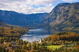 Buildings, boats, and mountains make up the stunning slovenia collection. Lake Bohinj Landscape In Autumn In Slovenia Photograph By Ipics Photography
