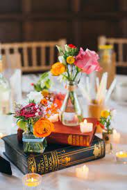 19 Ways To Have The Literary Wedding Of Your Dreams Wedding Themes Unique Book Wedding Centerpieces Unique Wedding Centerpieces