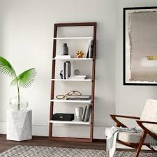 This ladder bookcase is great for small spaces that need a little more surface area to display and organize objects. Leaning Wall Ladder Shelf Wayfair