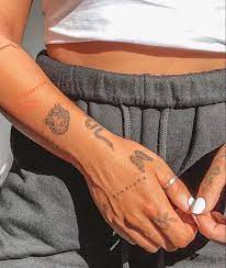 This minimalistic hand tattoo using decorative lettering is crisp and clean. 79 Small Tattoos For Guys Ideas In 2021 Tattoos Tattoos For Guys Small Tattoos