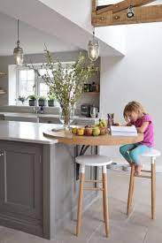 A raised up breakfast bar as a part of the kitchen island. 31 Unordinary Wooden Kitchen Island Ideas For Your Kitchen English Kitchens Design Modern Kitchen Island Kitchen Design Small