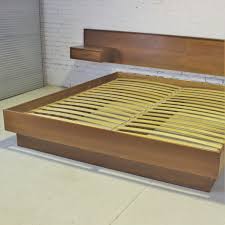 This clean, modern design delivers both sophistication and comfort. Vintage Scandinavian Modern Teak King Platform Bed With Attached Night Stands Warehouse 414
