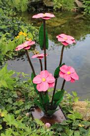 I've had many say they like the idea of recycling. Yard Art Blooming Flowers Recycled Metal Daisies In 3 Sizes