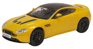 Image result for Sunburst Yellow 2012 Aston Martin