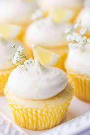 Vertical Image Of Lemon Cupcakes With Lemon Curd Filling And Lemon Cream Cheese Frosting Garnished With Lemon Wedge Cupcake Recipes Savoury Cake Lemon Recipes