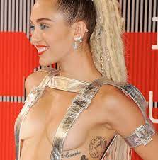 Jun 18, 2021 · miley cyrus is the face of gucci beauty's flora gorgeous parfum and wears the initial rings worn by harry styles. Miley Cyrus Just Added A New Tattoo To Her Massive Collection Hellogiggles