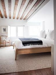 This primary bedroom boasts gray tiles flooring topped a primary bedroom featuring reddish hardwood flooring topped by a rug that matches the beige walls. Pin By Erin Hiemstra Apartment 34 On S L E E P Minimalist Bedroom Minimalist Bedroom Design Fall Bedroom