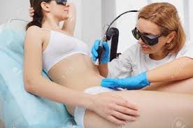 Hair on the abdomen is a very common problem for both men and women. Laser Hair Removal On Her Stomach On The Body Of A Young Woman In A Beauty Clinic Cosmetlog Removes The Hair On The Girls Abdomen With A Laser Stock Photo Picture And