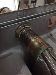 Turn off valves to prevent a mess. How To Remove Stubborn Kitchen Faucet Mount Nut Home Improvement Stack Exchange