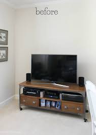 How to decorate the wall behind the tv. Adding A Shelf Above The Tv A Simple Decorating Solution Driven By Decor